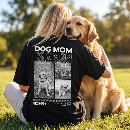 Camiseta negra con el texto "DOG MOM" y fotos de perros en la espalda, llevada por una persona con un perro.
