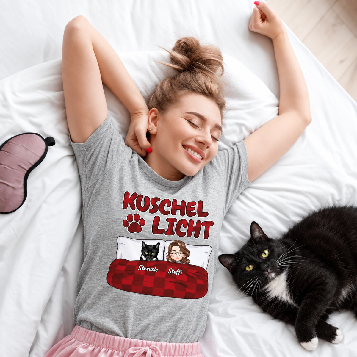 Camiseta gris con el texto "Kuschel Licht" y figuras estilo dibujos animados.