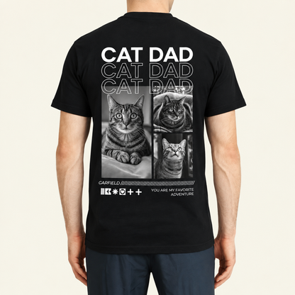 Camiseta negra con el texto "Cat Dad" y fotos de gatos en la espalda.