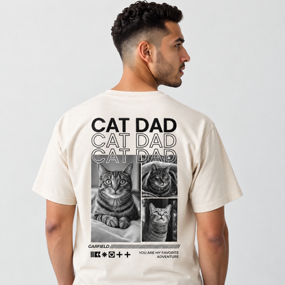 Camiseta beige con motivo de gato y el texto "CAT DAD" en la espalda.
