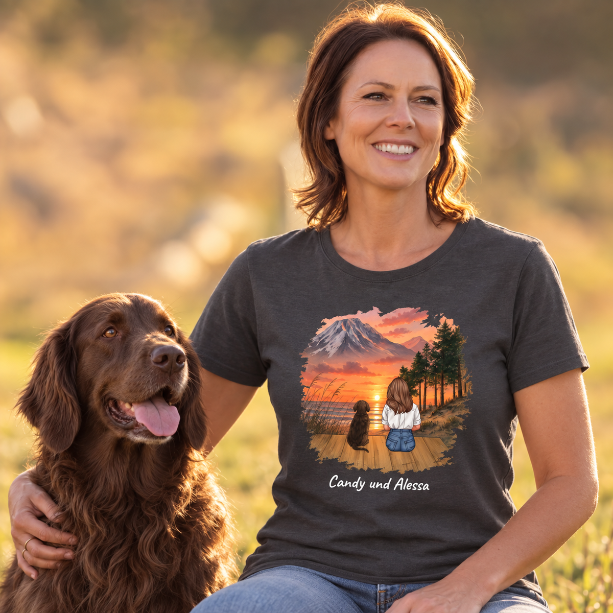 Camiseta gris oscuro con motivo personalizado de una mujer y un perro ante un paisaje de montaña.