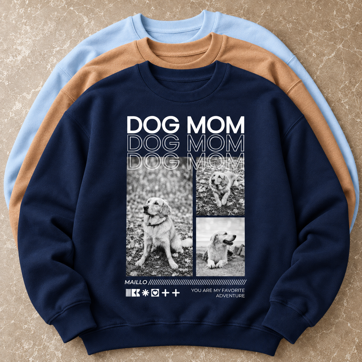 Sudadera azul oscuro con el texto "Dog Mom" y fotos de perros, en un grupo de tres sudaderas.