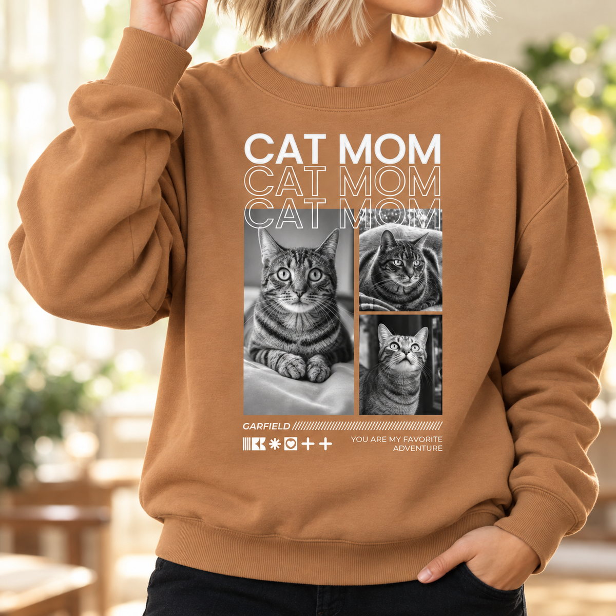 Sudadera marrón con el texto "Cat Mom" y fotos de gatos.