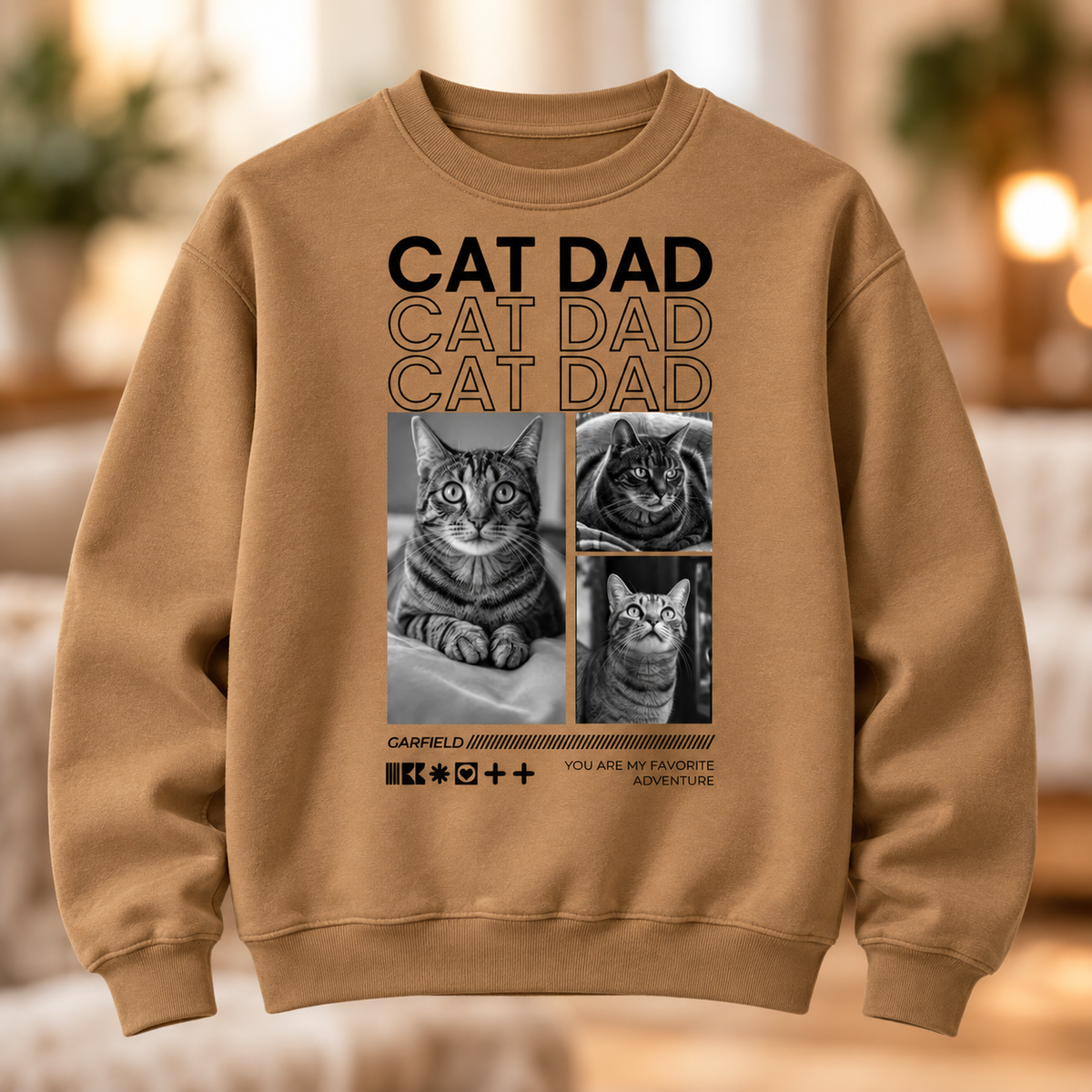 Sudadera marrón con motivos de gatos y el texto "Cat Dad".