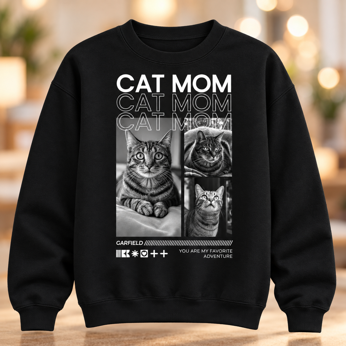 Sudadera negra con el texto "Cat Mom" y fotos de gatos en blanco y negro.