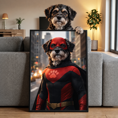 Un perro con disfraz de superhéroe, capa roja y máscara, la imagen en un marco.