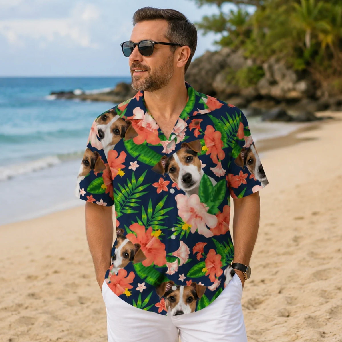 Hombre con camisa hawaiana personalizada con motivos de perros y flores de colores, en la playa.