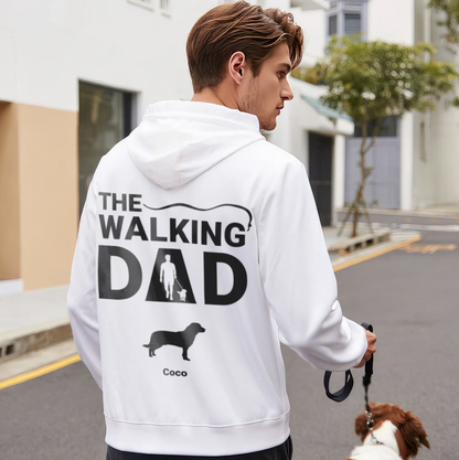 Sudadera con capucha blanca con el texto "THE WALKING DAD" y un gráfico de perro y persona.