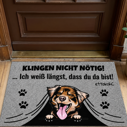 Felpudo personalizado con motivo de perro y fondo gris, texto: "KLINGEN NICHT NÖTIG!"